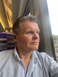 Alan D West
